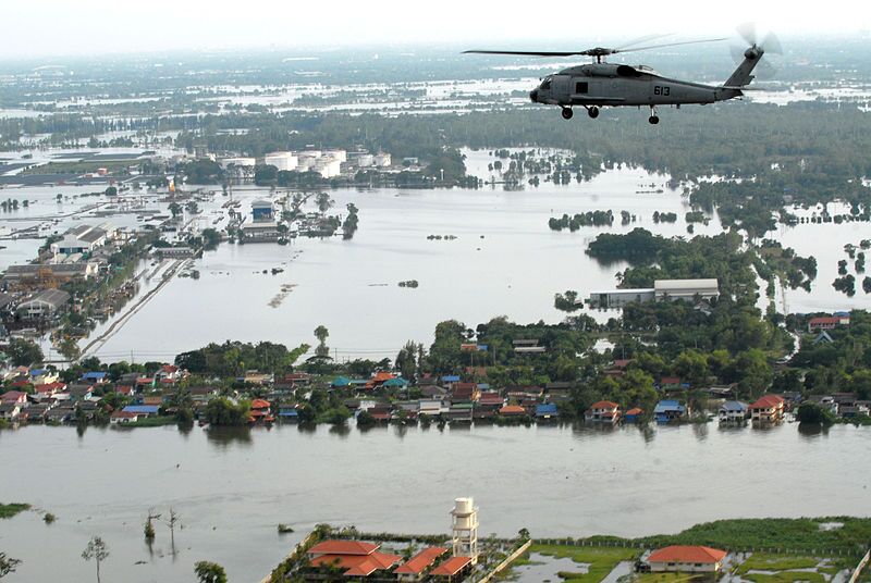 A US Navy Sea Hawk helicopter assesses the damage outside Bangkok during the 2011 floods