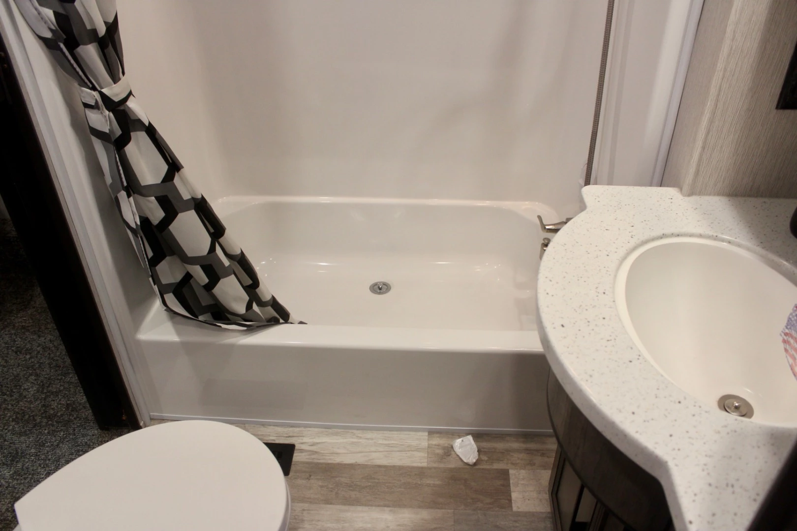 A look at the master bed bathroom — you know someone is curling up in that tub-like shower floor for a nap, missing the entire game