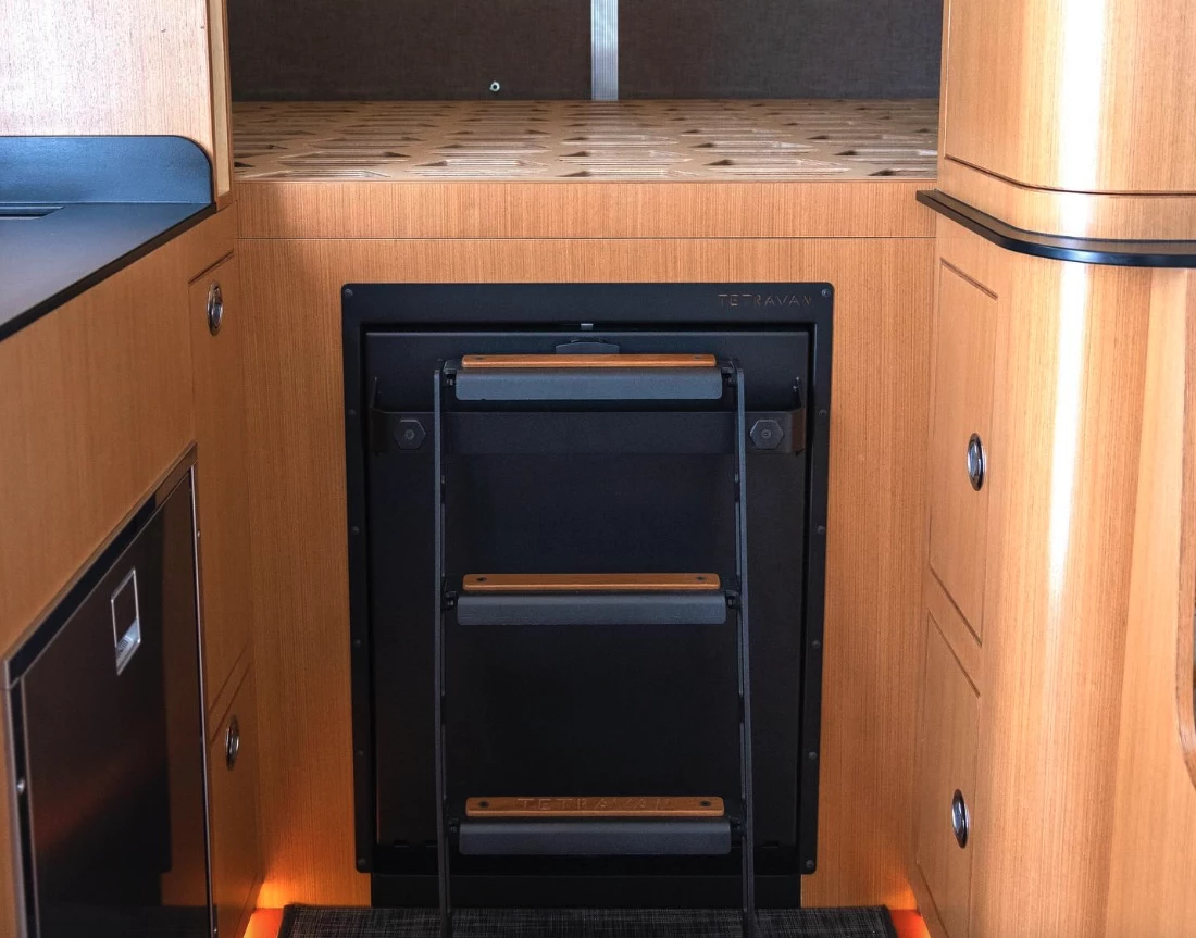 The trailer includes the attachable bed ladder on the front of the shower