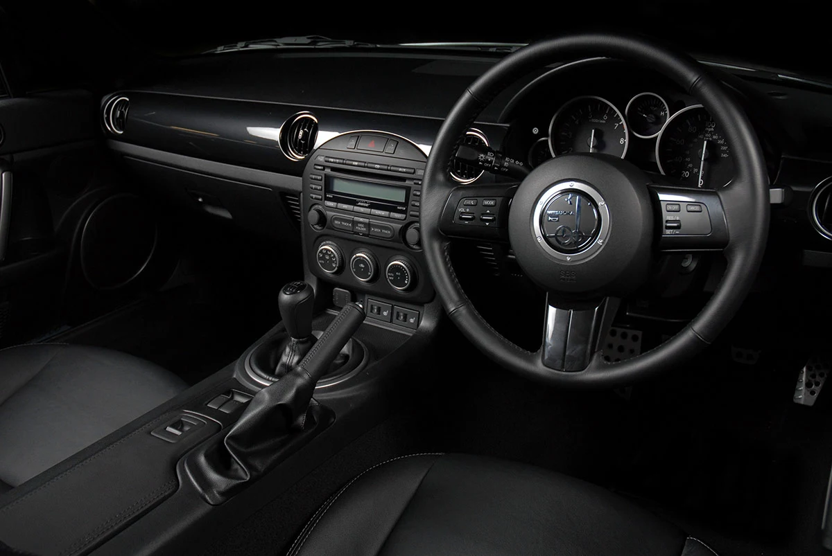 The interior is unmistakably from an NC Mazda MX-5