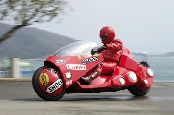 Tejima even donned a red leather outfit matching the main character's in the movie and toured Japan recently