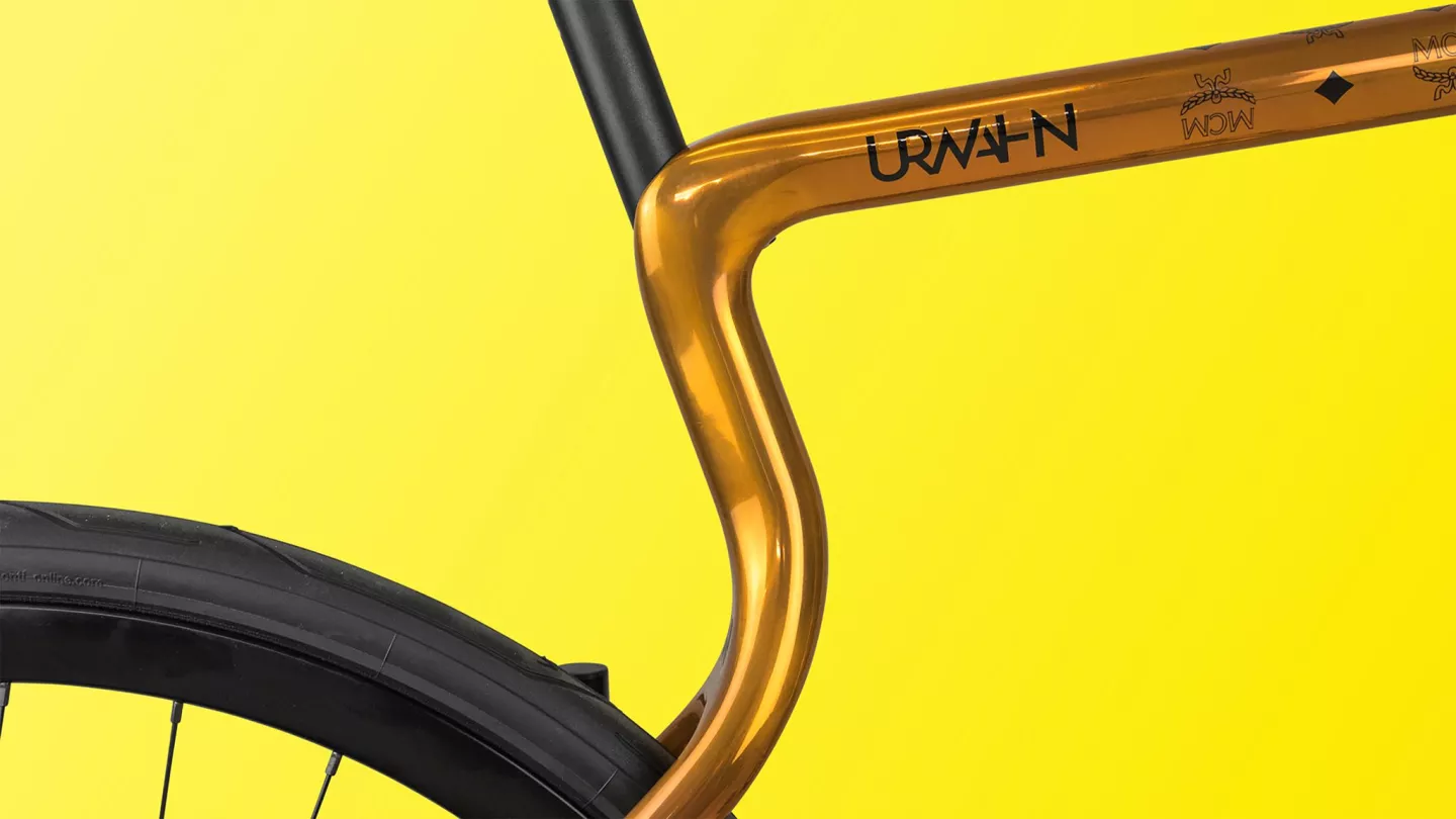 The frame's seat tube curves back and splits in two to become the seat stays
