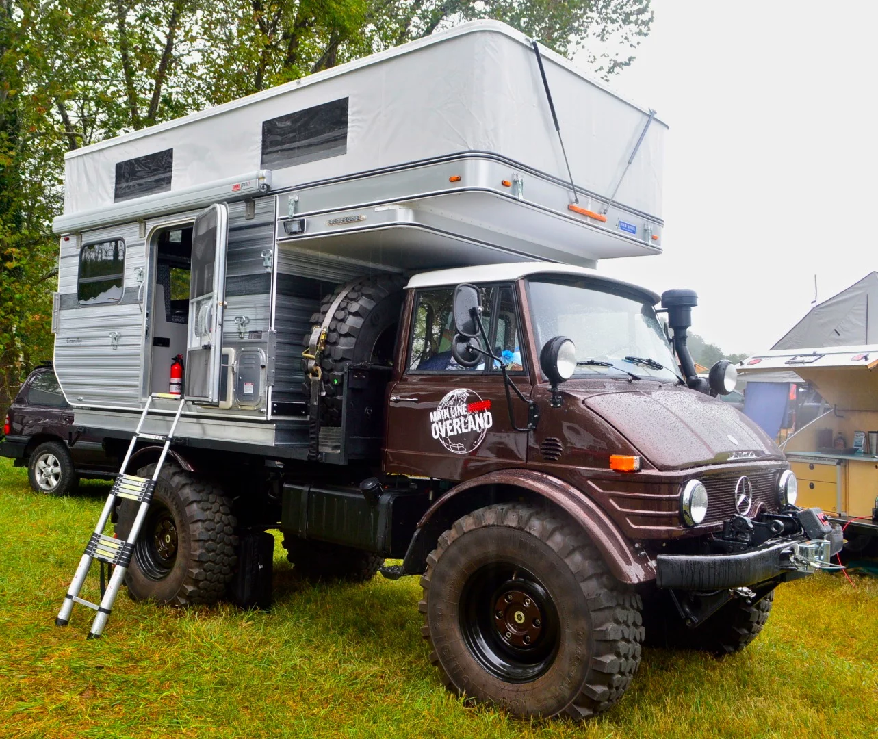 The Four Wheel Camper looks especially tough when bolted to a big, brown Unimog