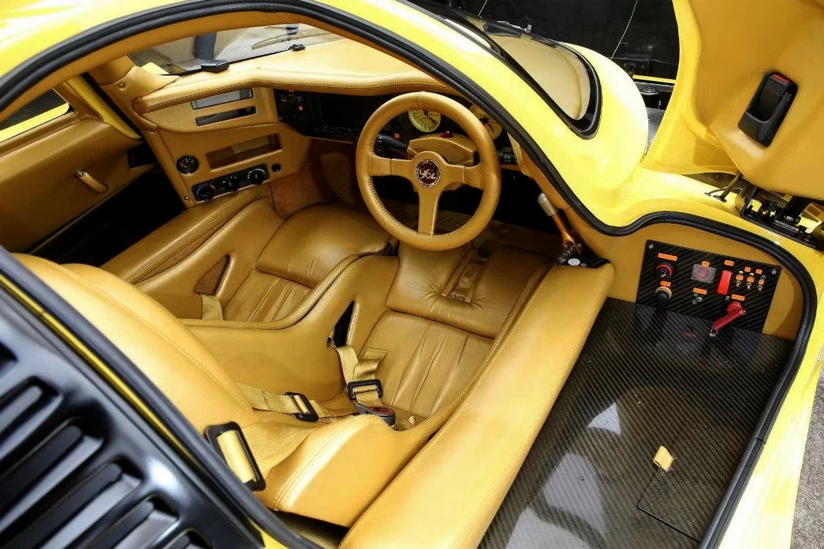In both 2018 and again in 2021, Bingo's Chiyoda City showroom in central Tokyo sold this yellow Schuppan 962CR for an undisclosed amount. The yellow color scheme helps to show the sumptuous leather-clad interior of the 962CR, which nonetheless still shows its Le Mans Sports Car Racing heritage. There are a dozen detailed images of this car in the image gallery for this article.