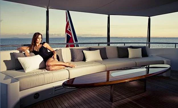A guest enjoys M/Y Satori's aft lounge area
