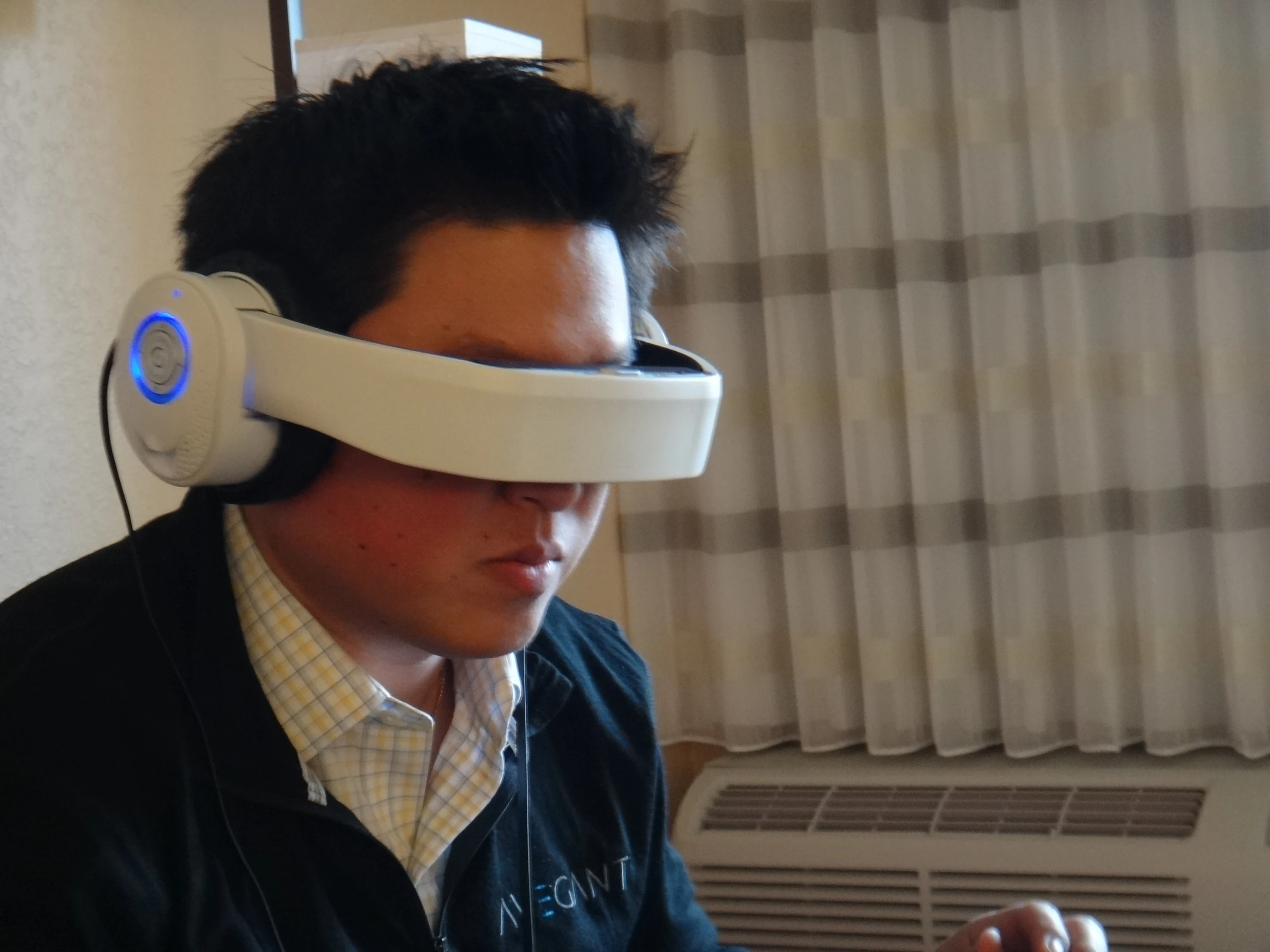 Since the alpha prototype of the Glyph is still quite fragile, Tang put the headband/visor down for me before fitting it over my head