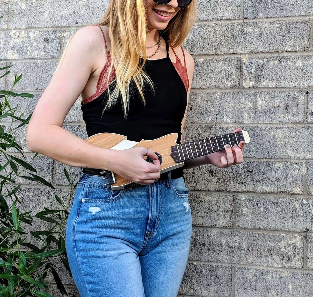 The Ava ukulele has a fold-out wing to help with forearm playing comfort