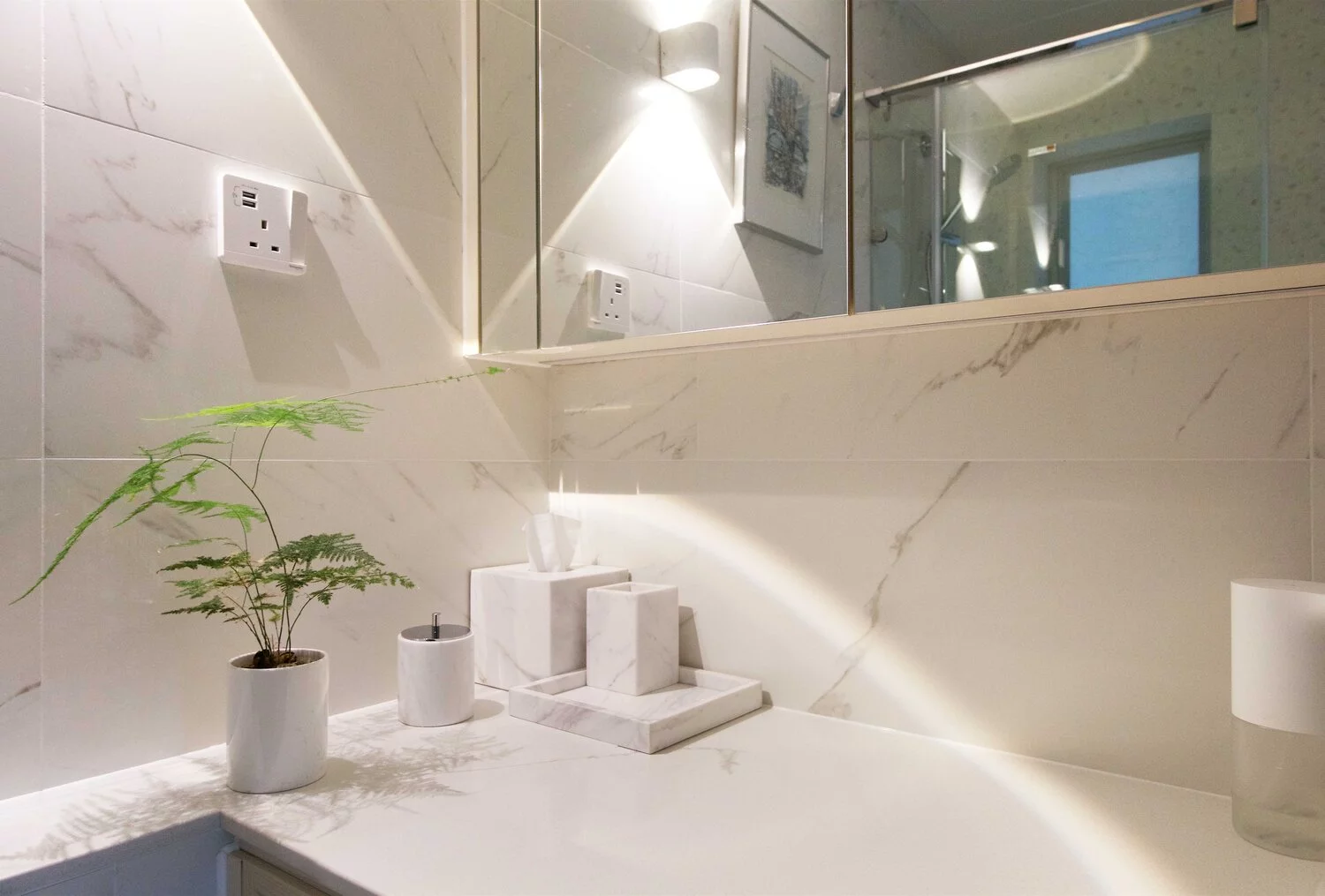 The luxury bathroom is bright and light filled