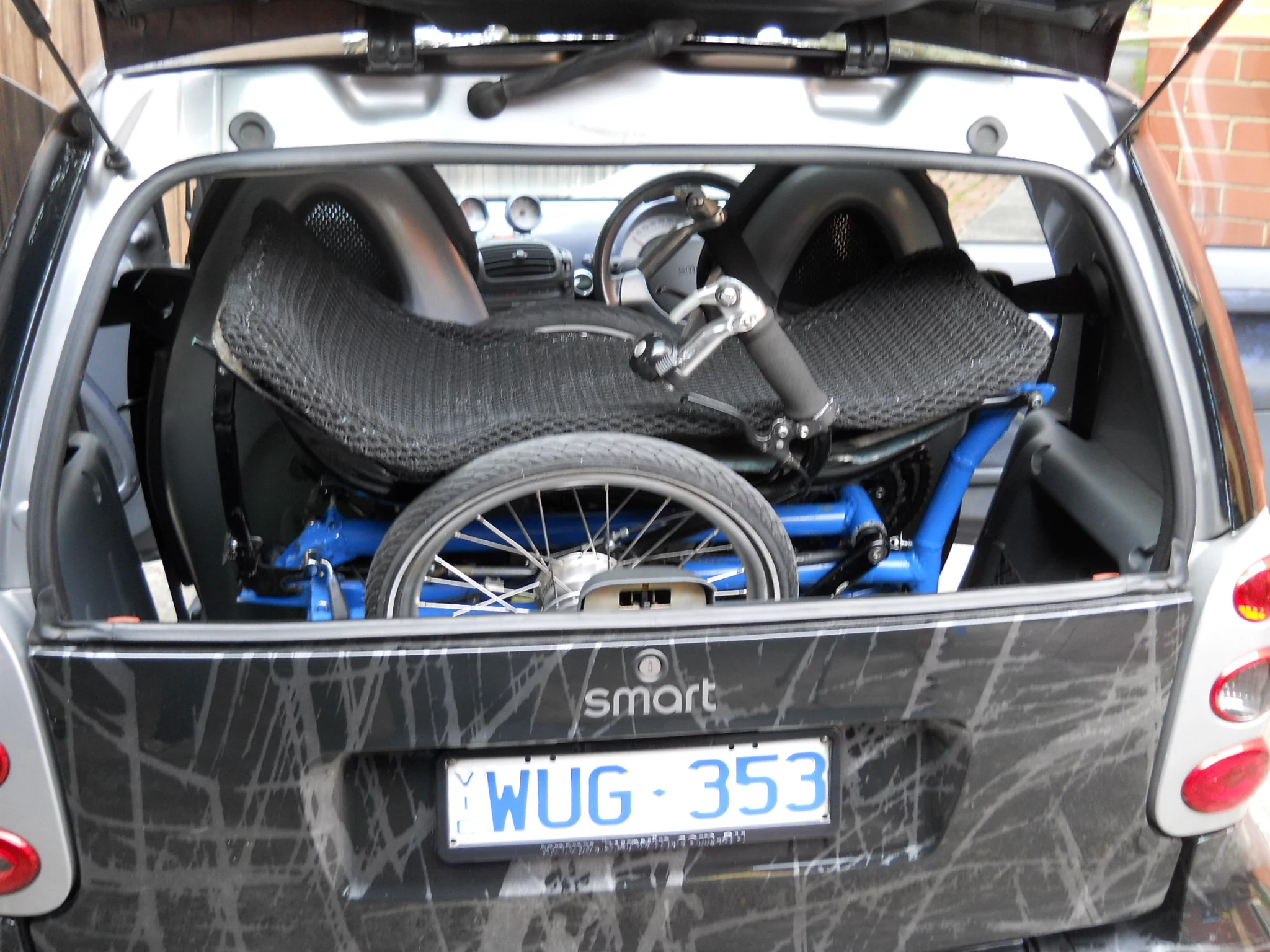 The Evolve trike fits in the back of a smart car