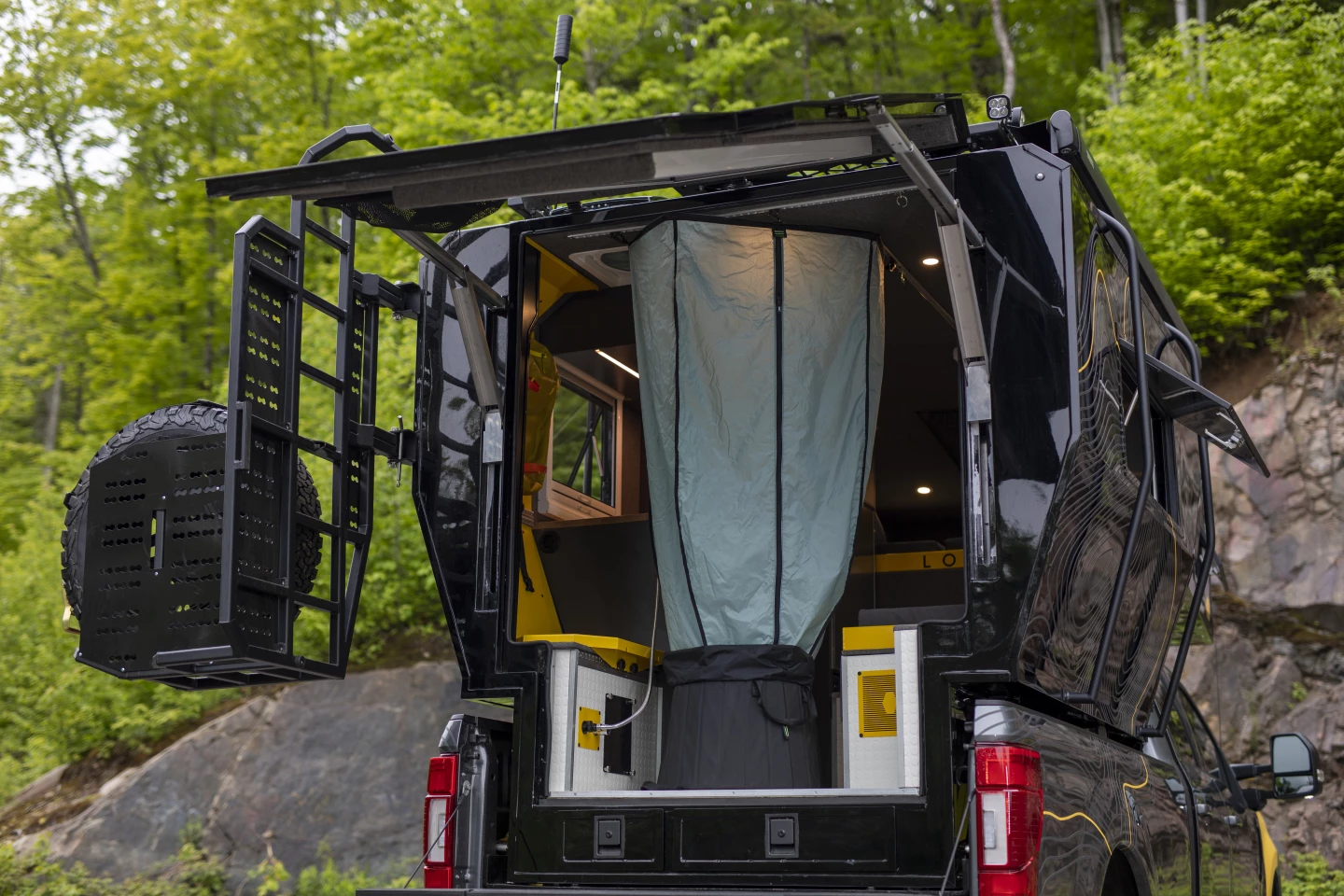 As we've seen on Norva camper vans, the Loki Basecamp Falcon includes a retractable shower area right inside the rear entry