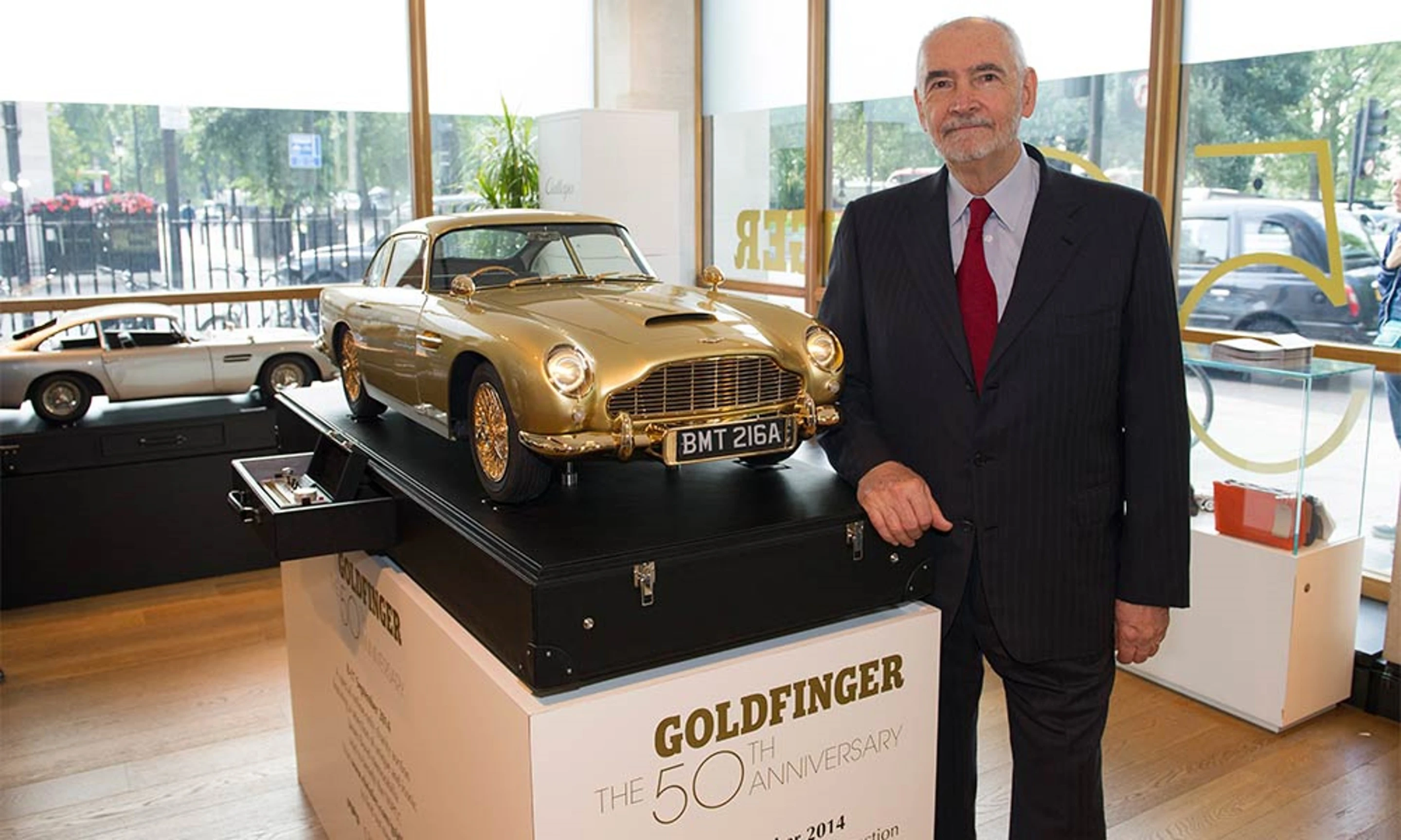 The scale replica with EON productions CEO Michael G Wilson OBE (Image: Aston Martin)