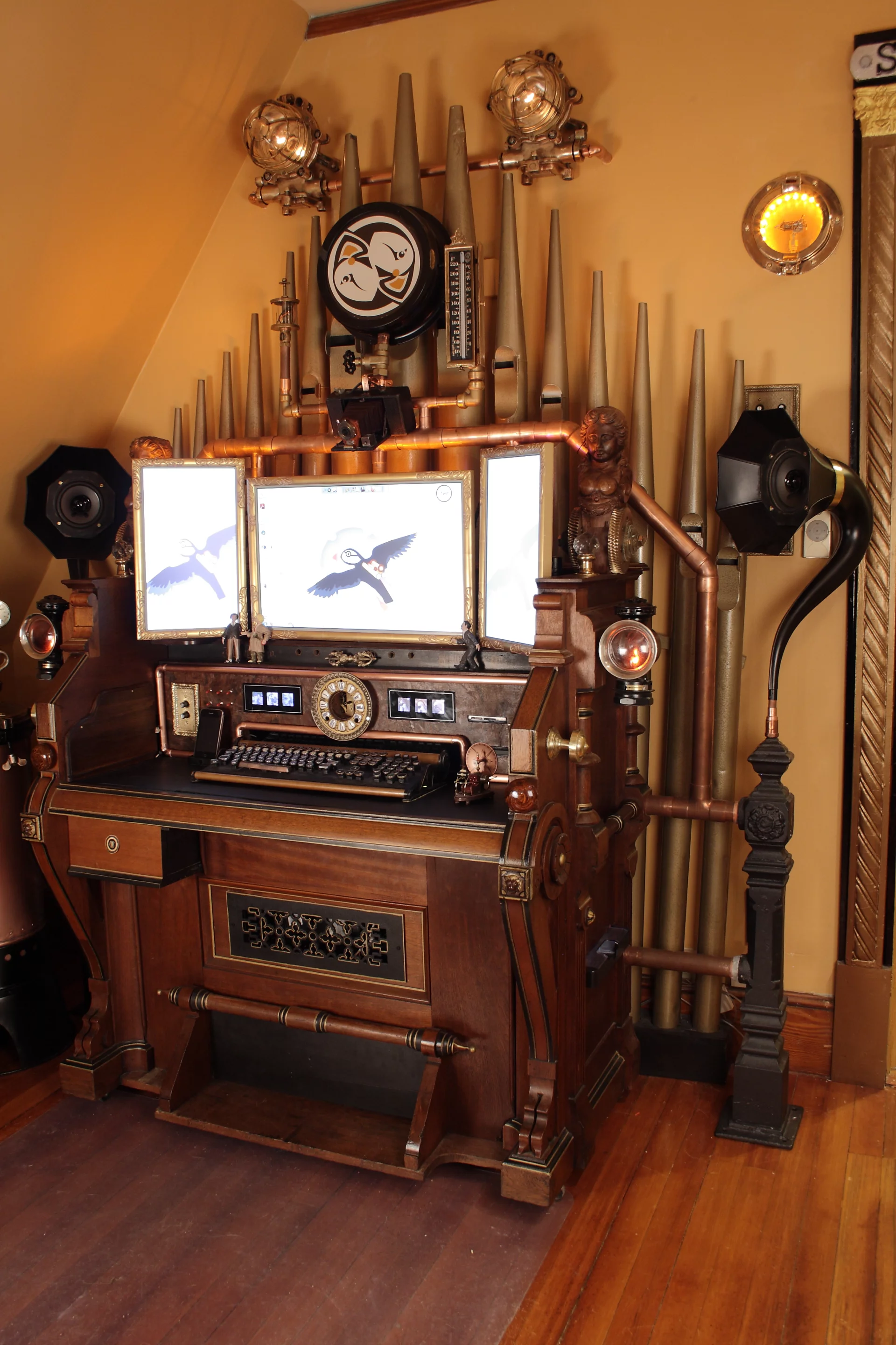 The Victorian Organ Command Desk sports a 23in and two 15in Steampunk monitors