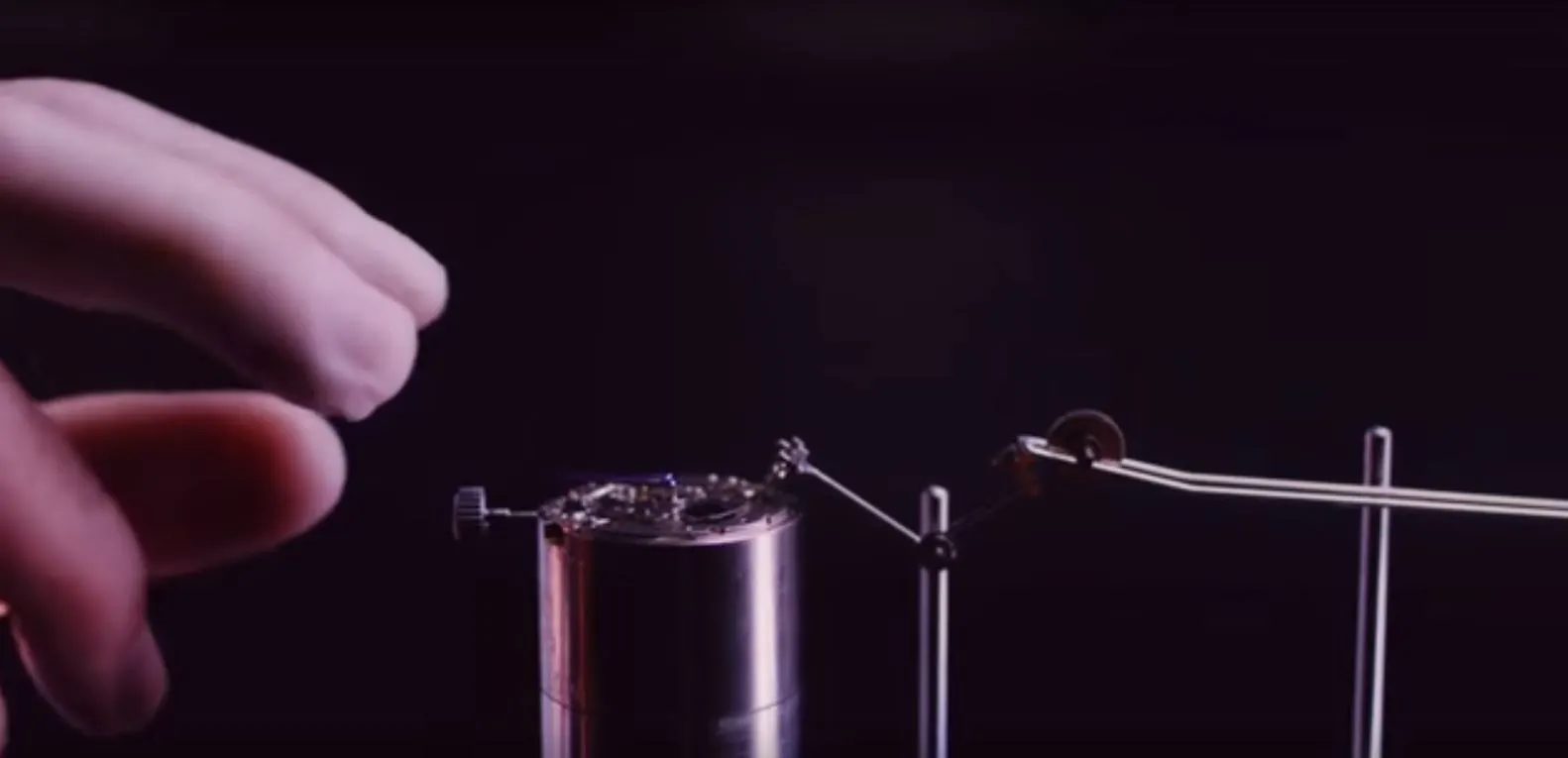 The action starts with winding a watch movement