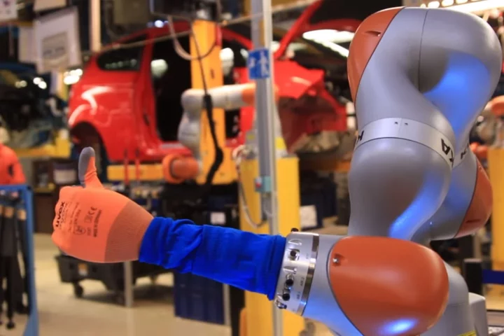 Ford is putting humans and robots side-by-side in Cologne