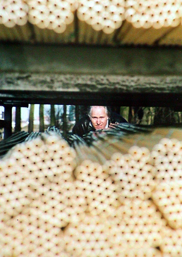 Theo Jansen with the yellow plastic tubes he uses to make the Strandbeests (Photo: Theo Jansen)