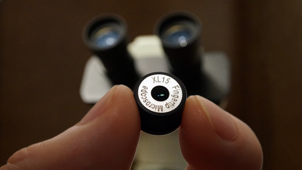 Pocket microscope backs away to show more of what you want to see