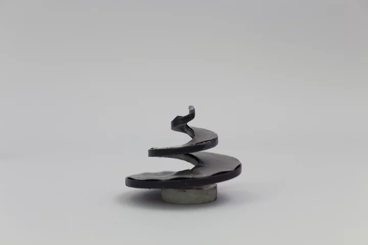 Prototype of a 3D-printed abstract spiral loudspeaker, that emits sound off its spiral surface (Photo: Disney Research)