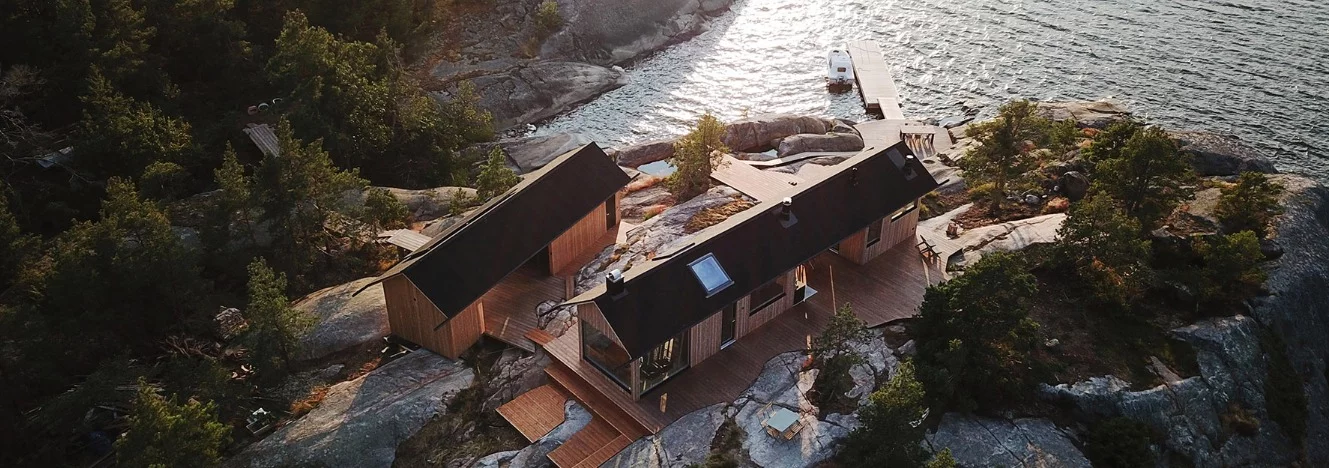 In order to work with the rocky conditions of the landscape and the strict building rules, the duo came up with an initial design for two self-sustaining timber dwellings
