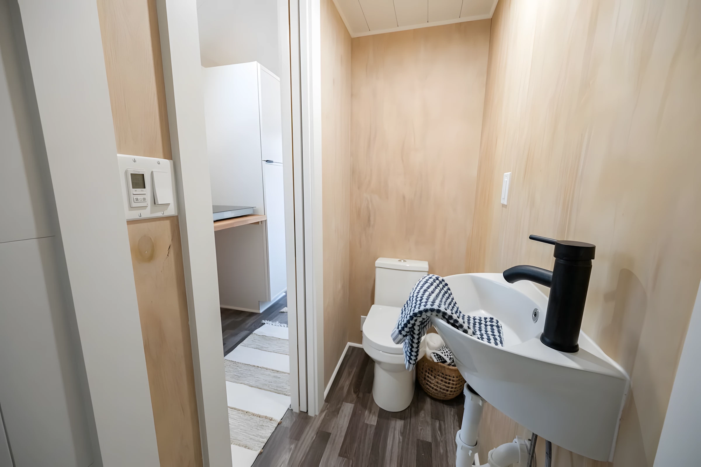 The Lad's bathroom includes a sink, shower, and a flushing toilet
