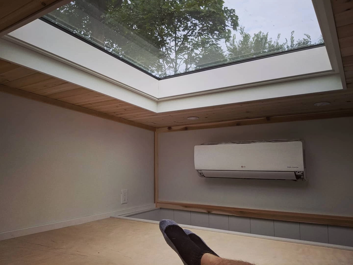 Extra-large skylight in the loft bedroom offers an unusually open and airy atmosphere