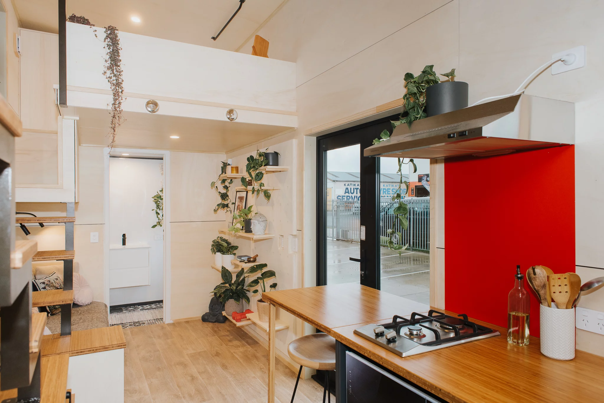 The River Bank includes a small living room with a sofa and a pegboard wall