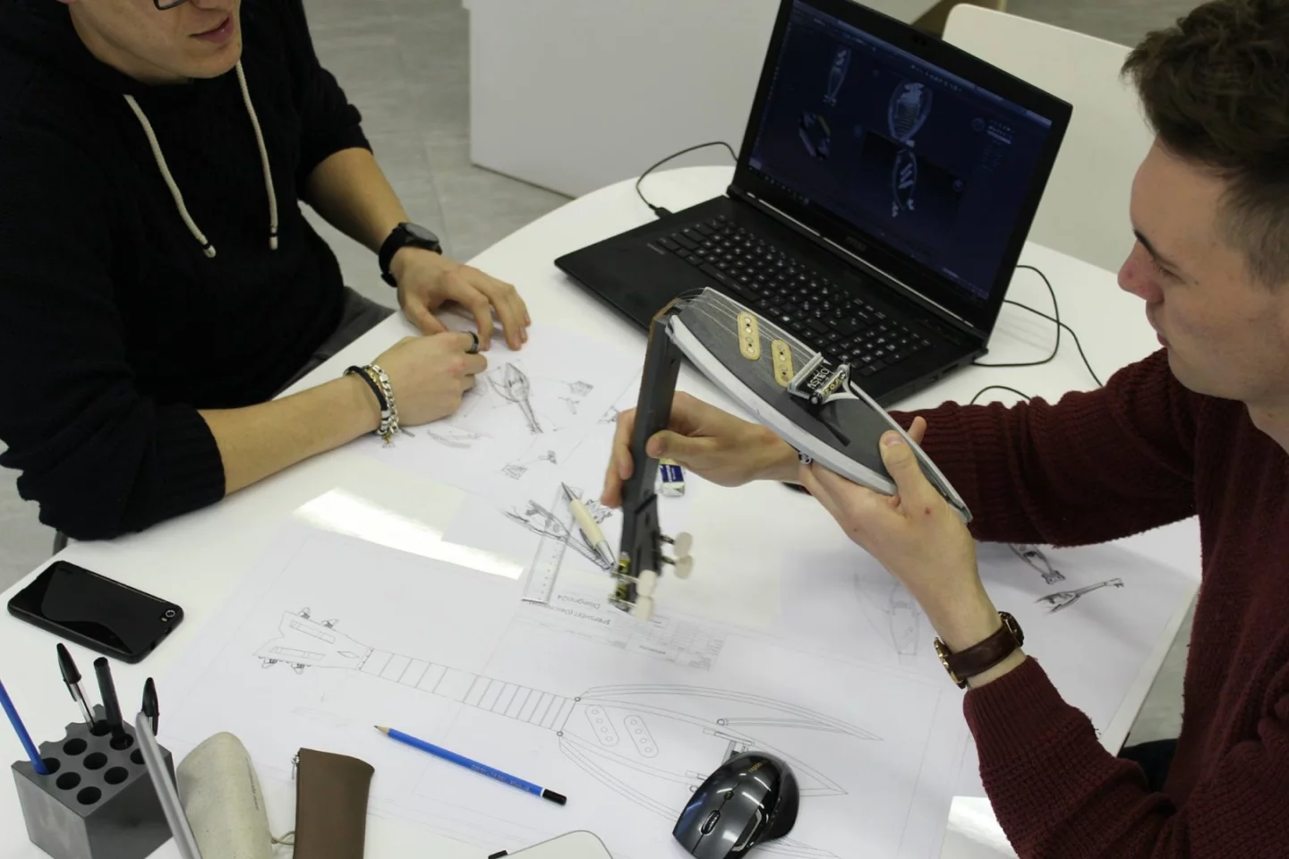 Unlike some stringed folders, the Astro ukulele's neck folds back against the body thanks to a patented hinge mechanism and a floating bridge