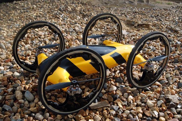 Each driving ring is driven not by a center-mounted axle, but instead by cog mechanisms at the bottom of the rim
