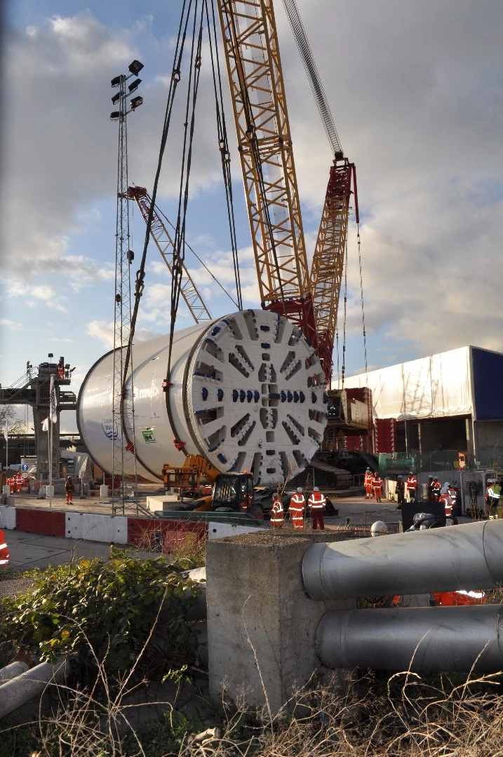 The tunnel boring machines both excavate and lay concrete segments around the freshly dug tunnel as they go