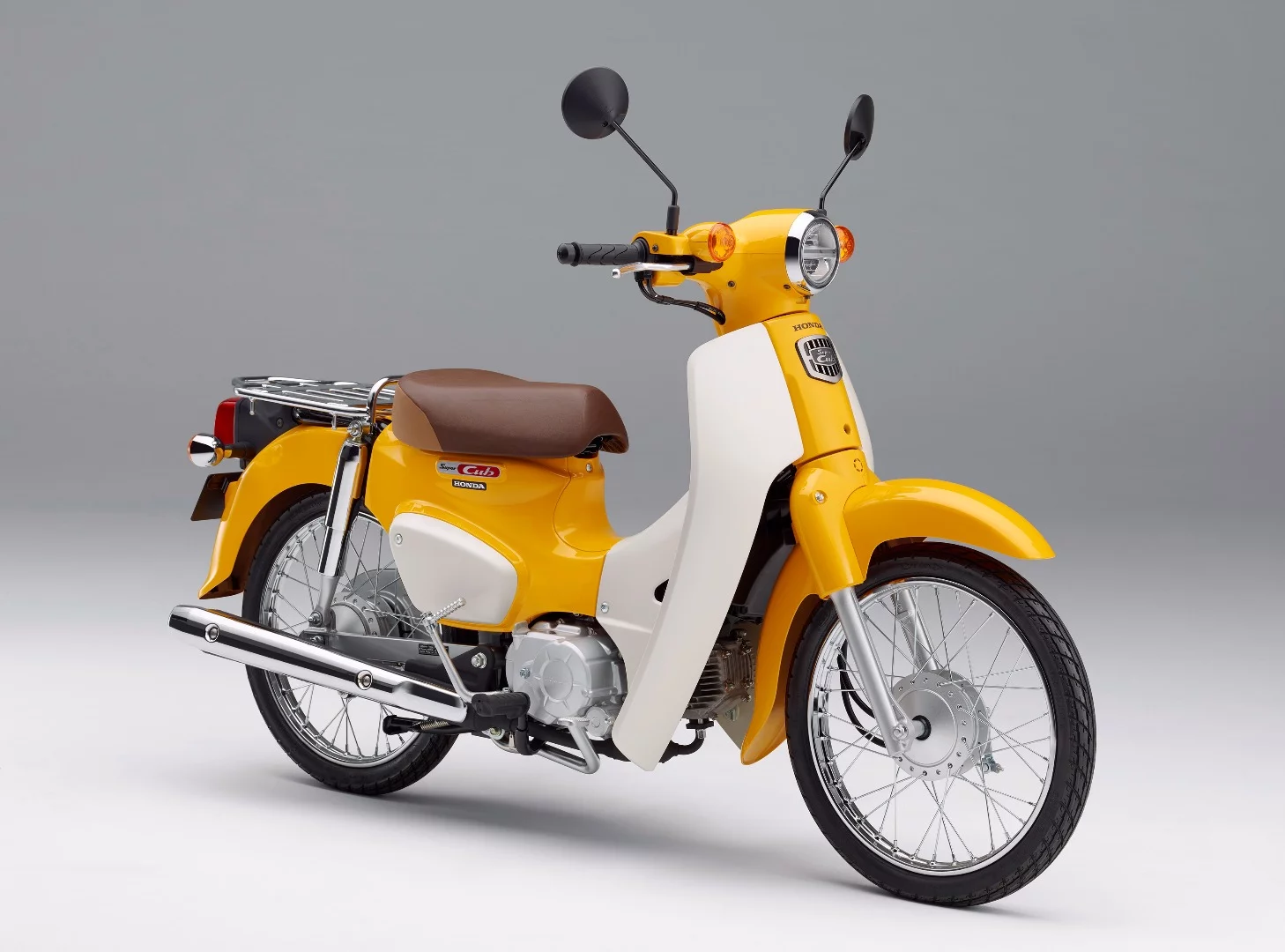 The 2018 Honda Super Cub in Pearl Shining Yellow color