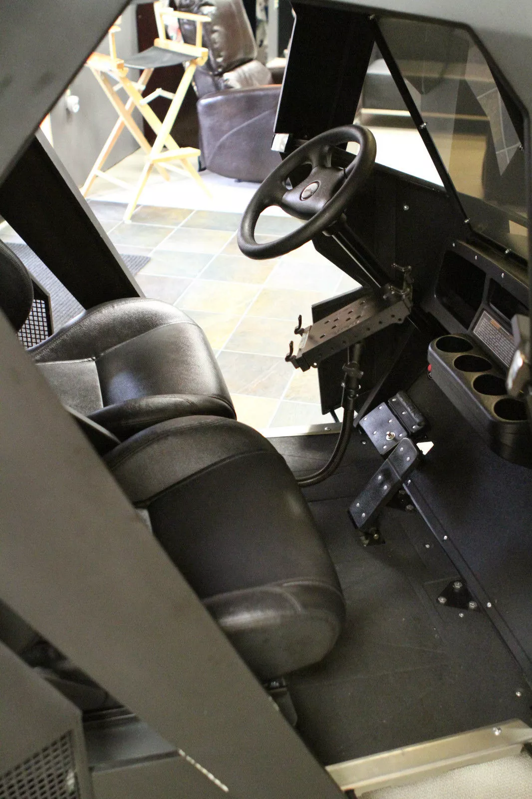 Batman cart has adjustable leather seats, four cup holders, iPad with stand, secret kill switch and a Batman logo on the sports steering column