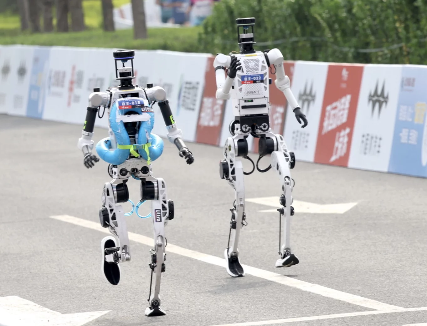 Some robot runners came prepared with safety gear in case of falls