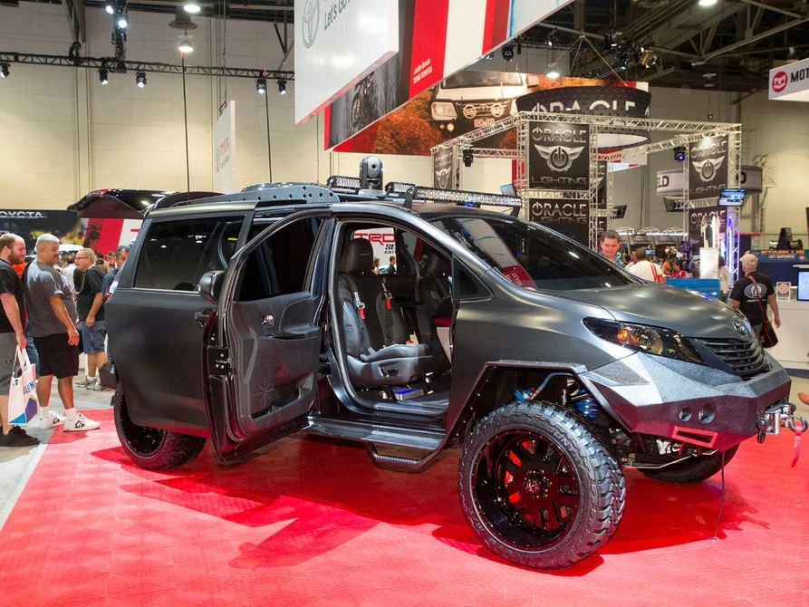 Toyota engineered around the large wheel/tire combo by hinging the front doors in back
