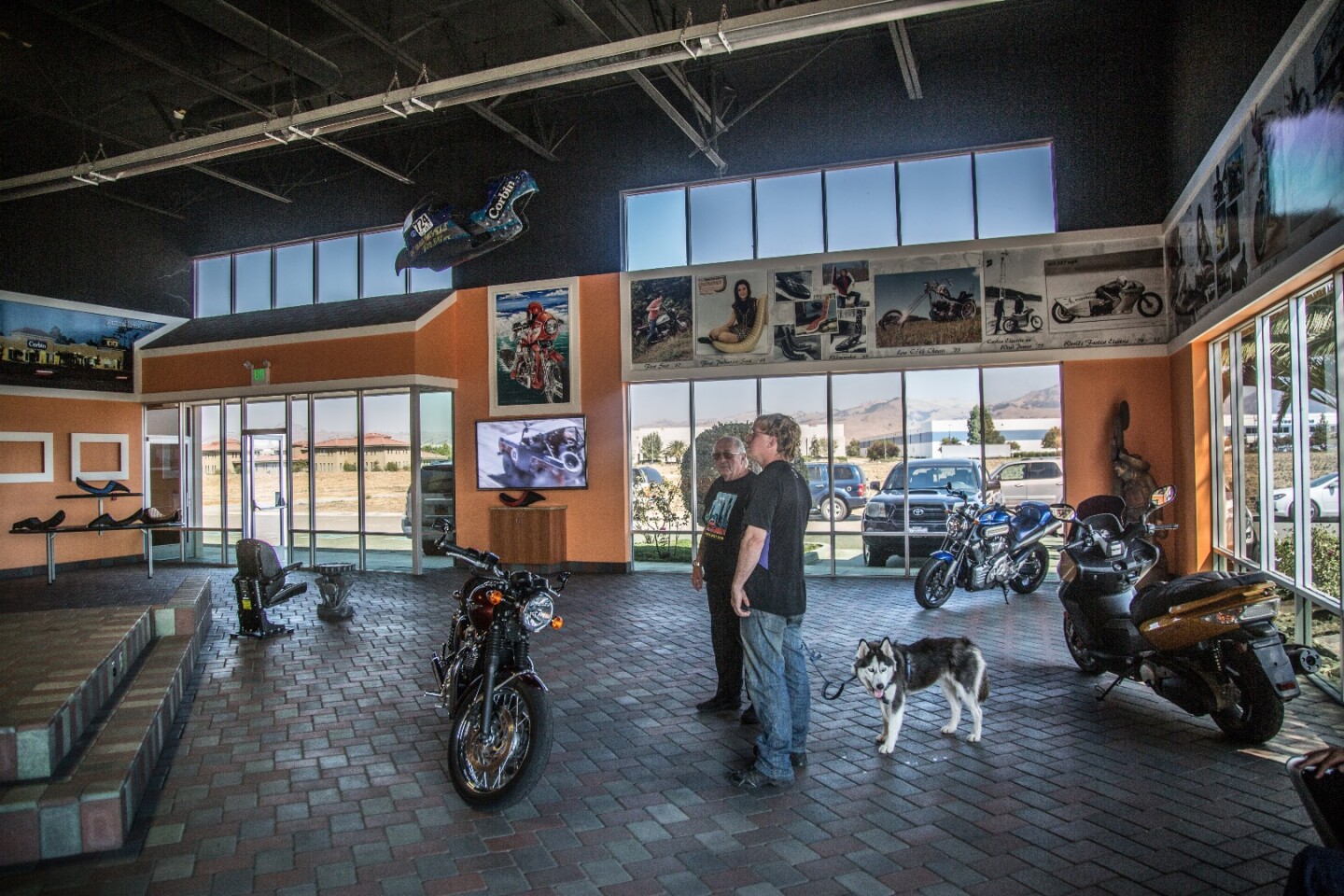 Mike Corbin with "Electric" Terry Hershner and his companion Charger in the Corbin showroom, Hollister, California