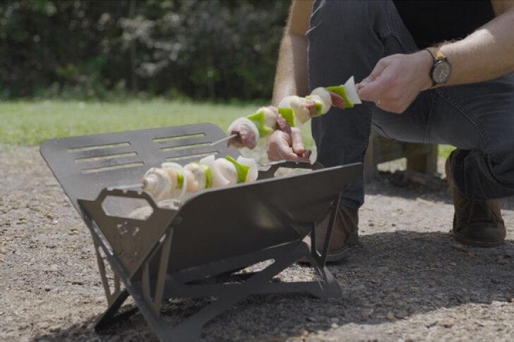 The Caveman grill features special slots for skewers