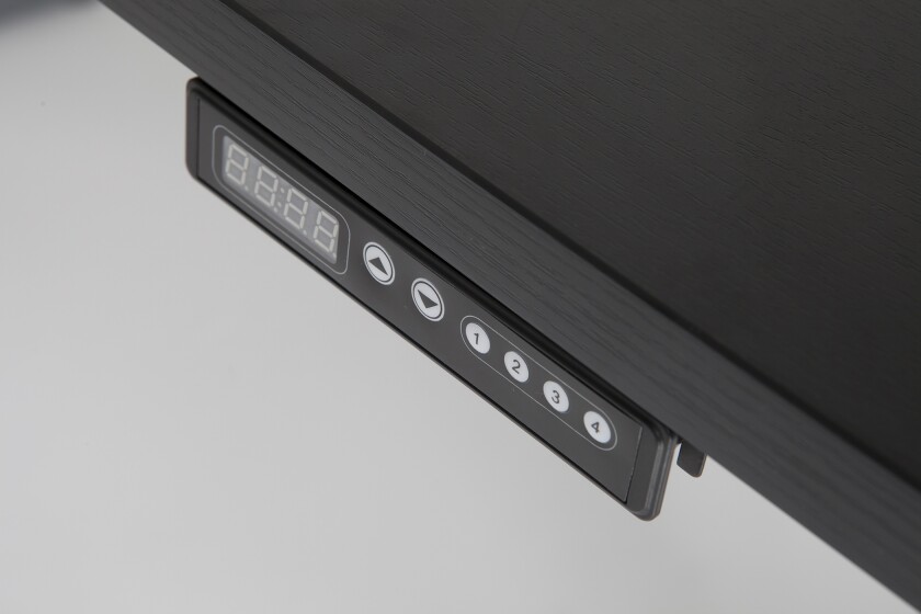 The controls of the deluxe model StandDesk feature extra buttons for programming preset heights