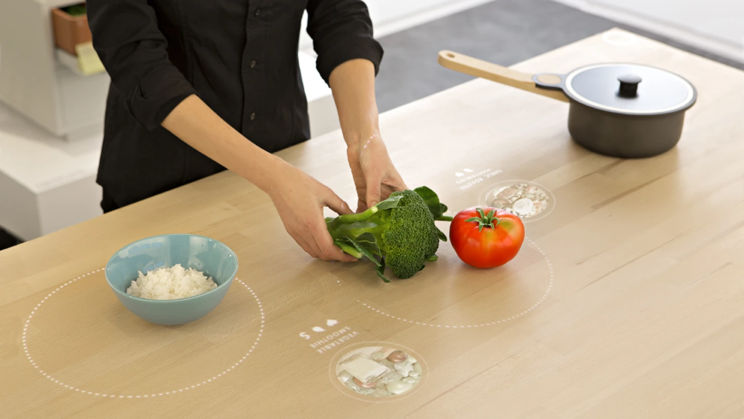Placing food on the table of the Ikea Concept Kitchen 2025 calls up recommended dishes that use them