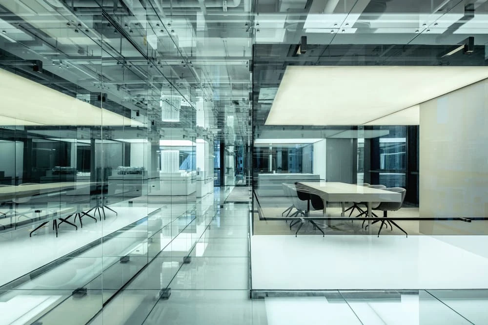 In order to cut down on glare, the aptly-named Glass Office also features areas of dull stone and carpet