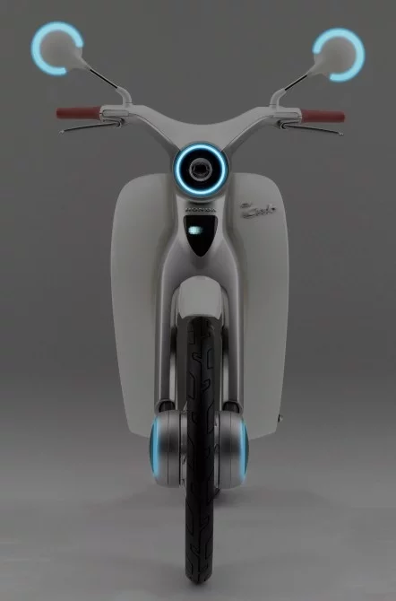 The EV-Cub electric motorcycle has an external communications system of some ilk, as demonstrated by this image from the Honda press library