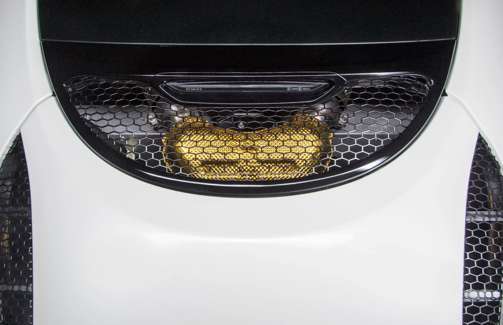 The exhaust heat shields are finished in a special gold titanium tint that will change color as the exhaust changes temperature