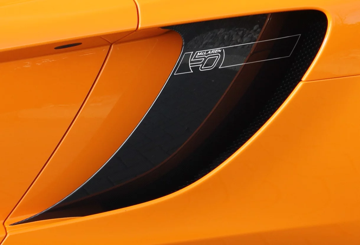 12C comes littered with 50th Anniversary graphics, a heritage badge on the bonnet and is available black, silver or orange