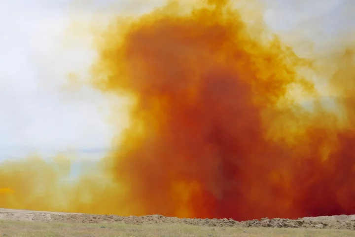 A cloud of nitrogen dioxide gas, released in a mine blast