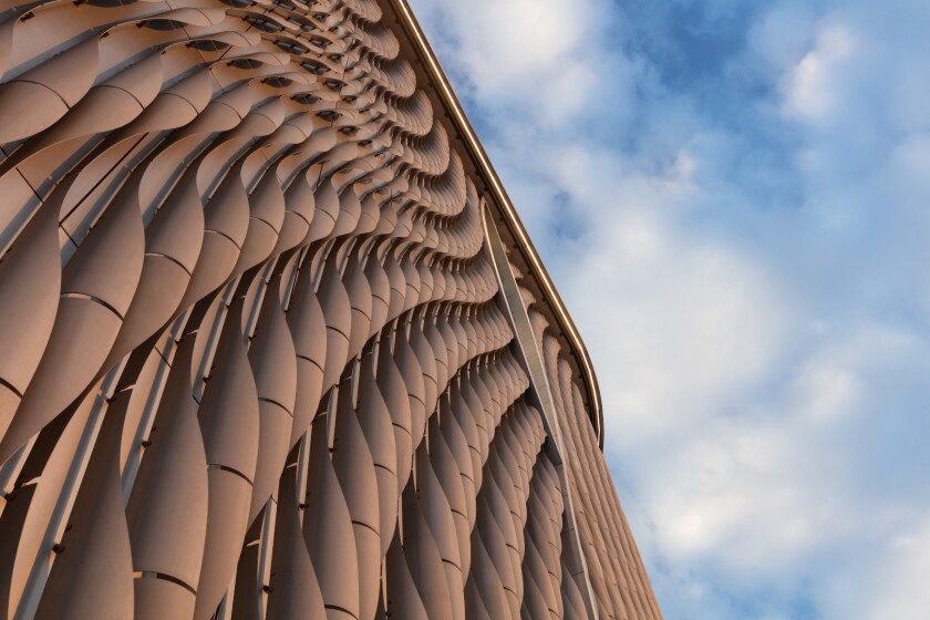 Closeup shot of the Xiqu Centre's aluminum facade