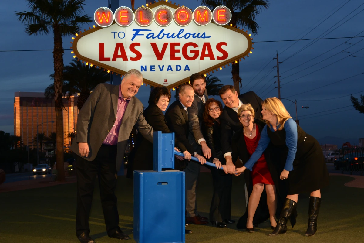 Local luminaries fire up the now solar-powered Las Vegas sign