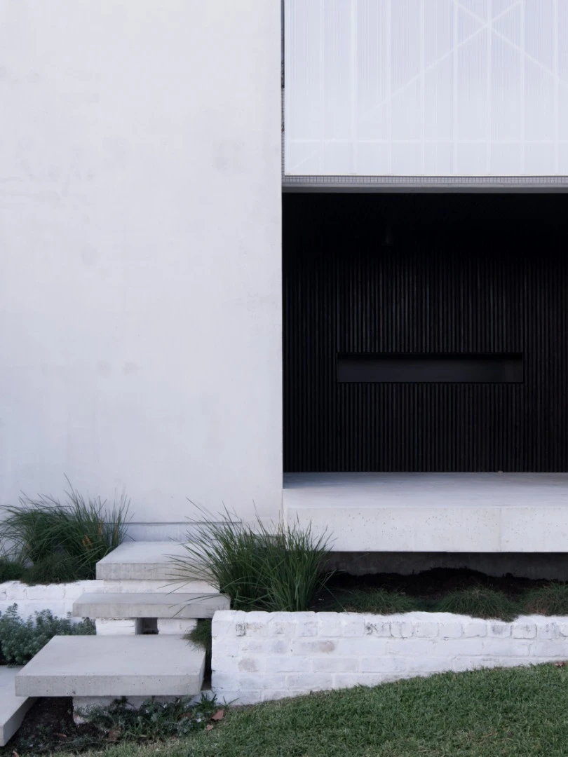 Simple landscaping leads to the home's entrance