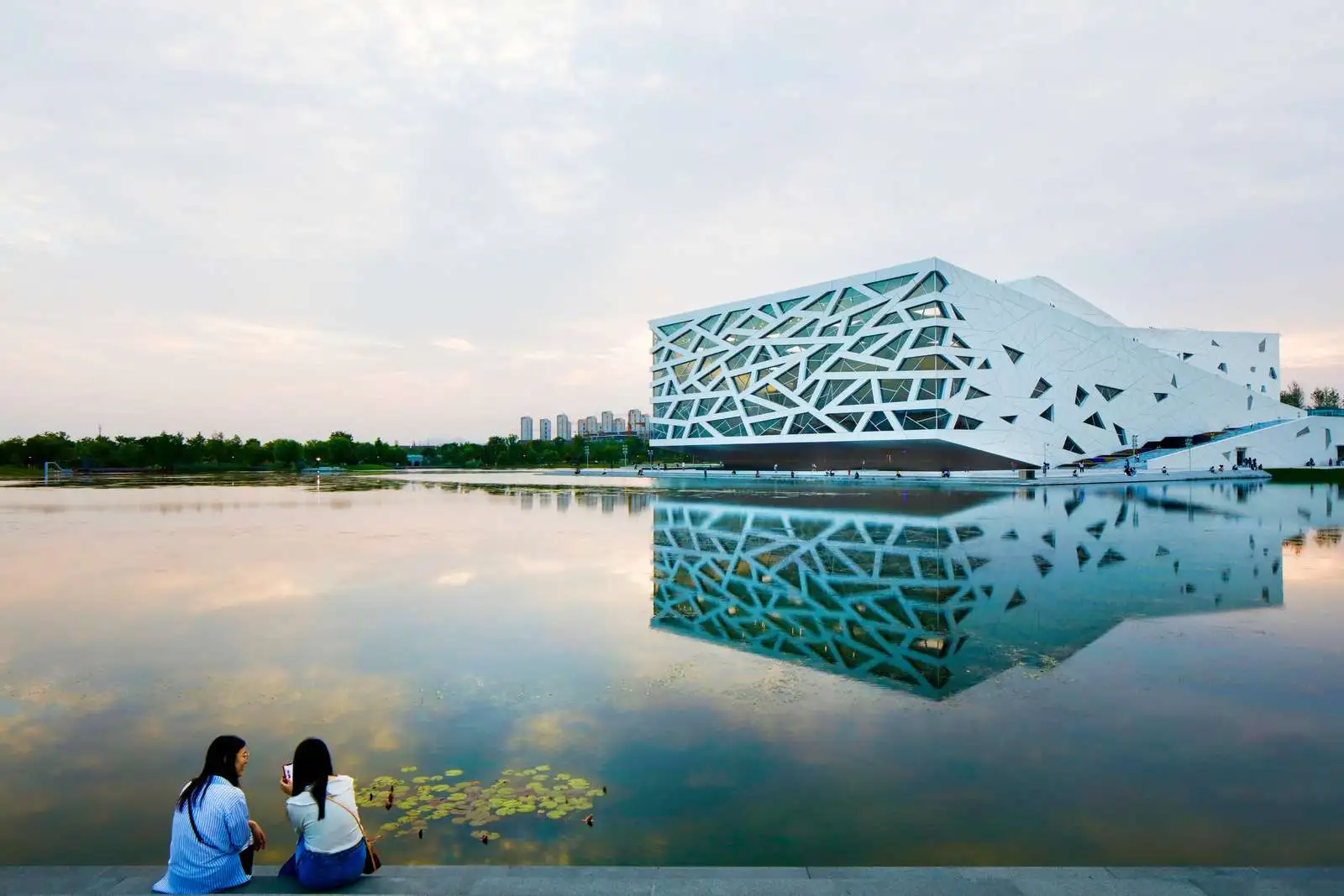 The Hangzhou Yuhang Opera is located next to a manmade lake
