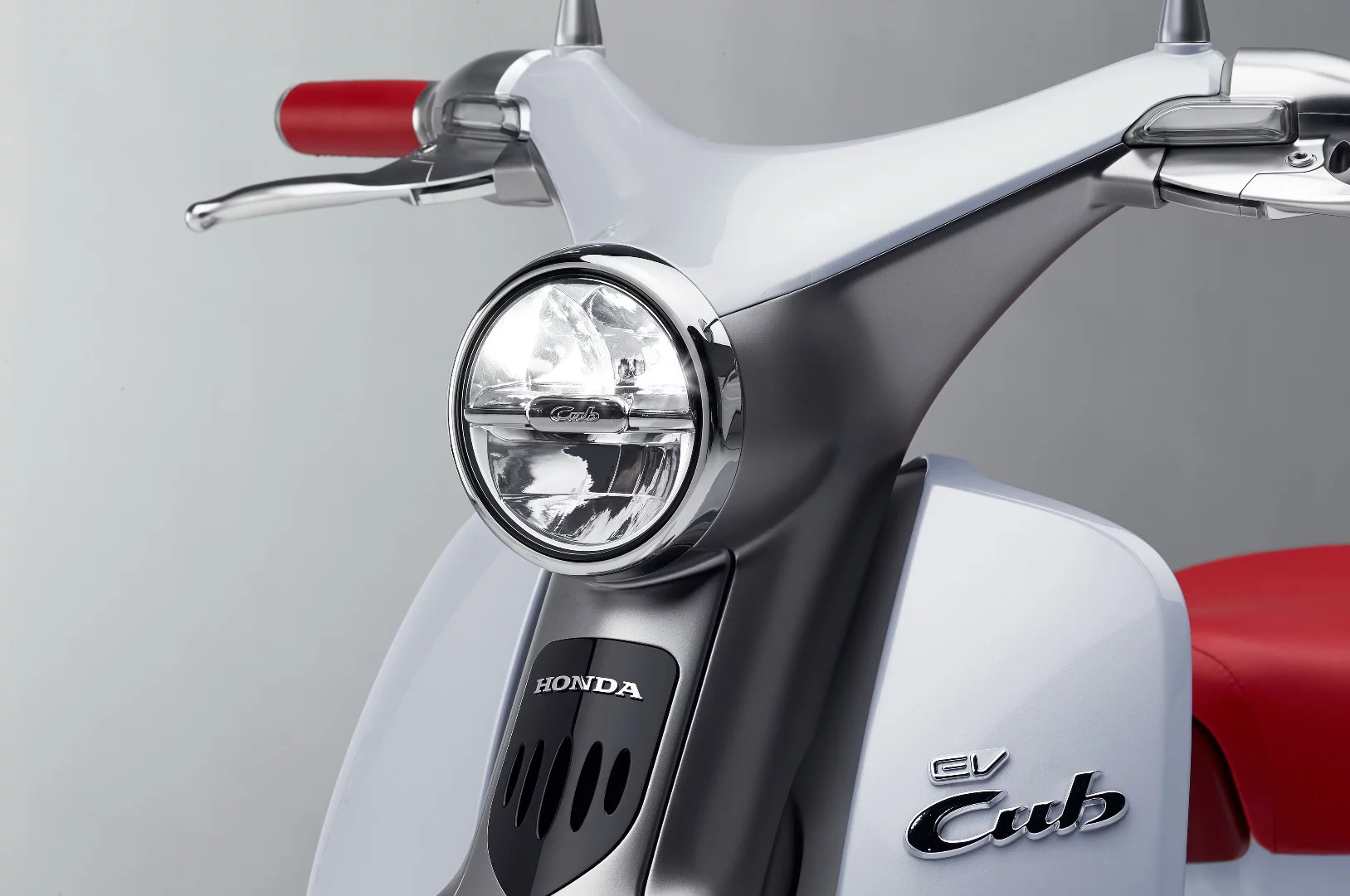 The latest EV-Cub concept uses a traditional-looking round headlight