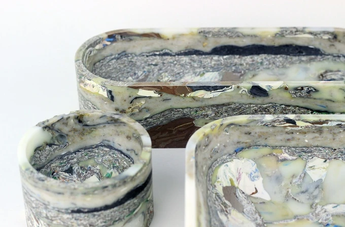 Small, medium, and large desk organizers crafted through Carter Zufelt's unique recycling process