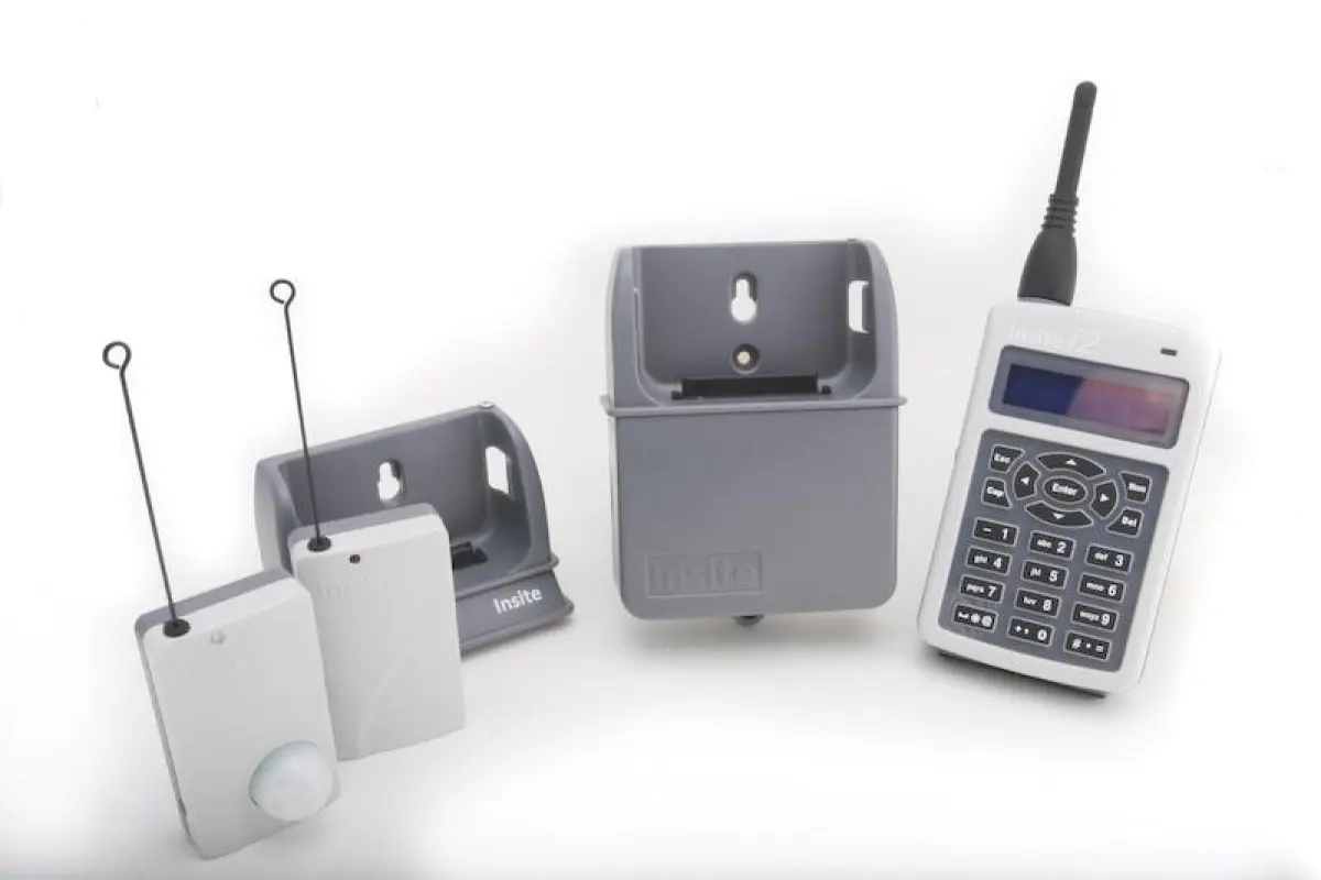 The Insite PGAMS i2 base unit, docking station, and wireless transmitters