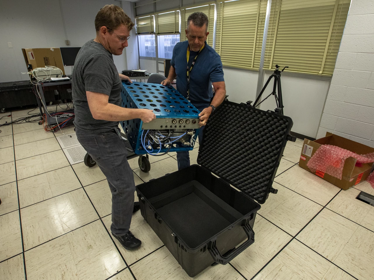 Loading the XVS pallet into a shipping box for delivery to Lockheed