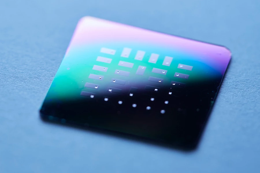 This silicon chip contains dozens of glucose fuel cells, visible as the small silver squares